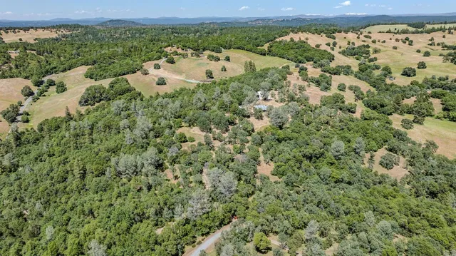 a kitchen with granite countertop a sink and cabinets