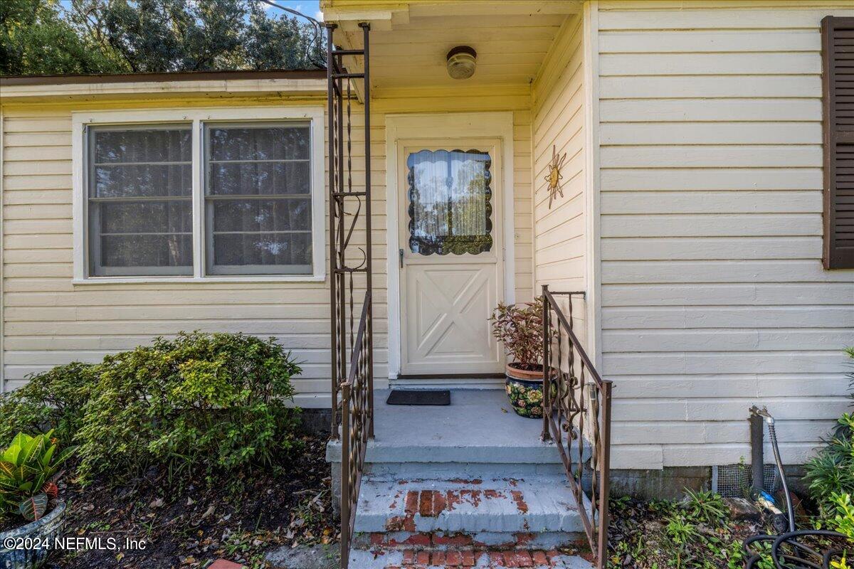 6554 Ortolan Avenue Jacksonville, FL 32216 - Photo 12 of 30 a front view of a house with a yard