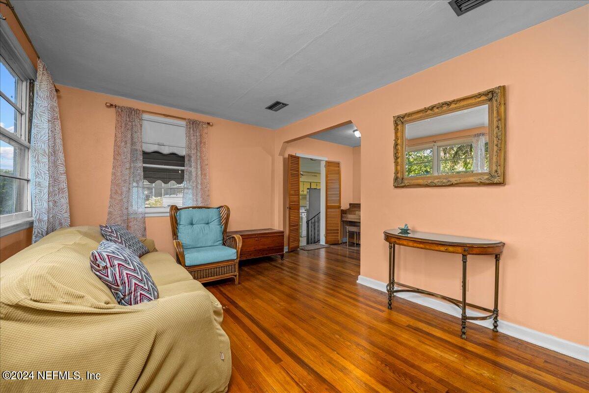 6554 Ortolan Avenue Jacksonville, FL 32216 - Photo 14 of 30 a bedroom with furniture and a wooden floor