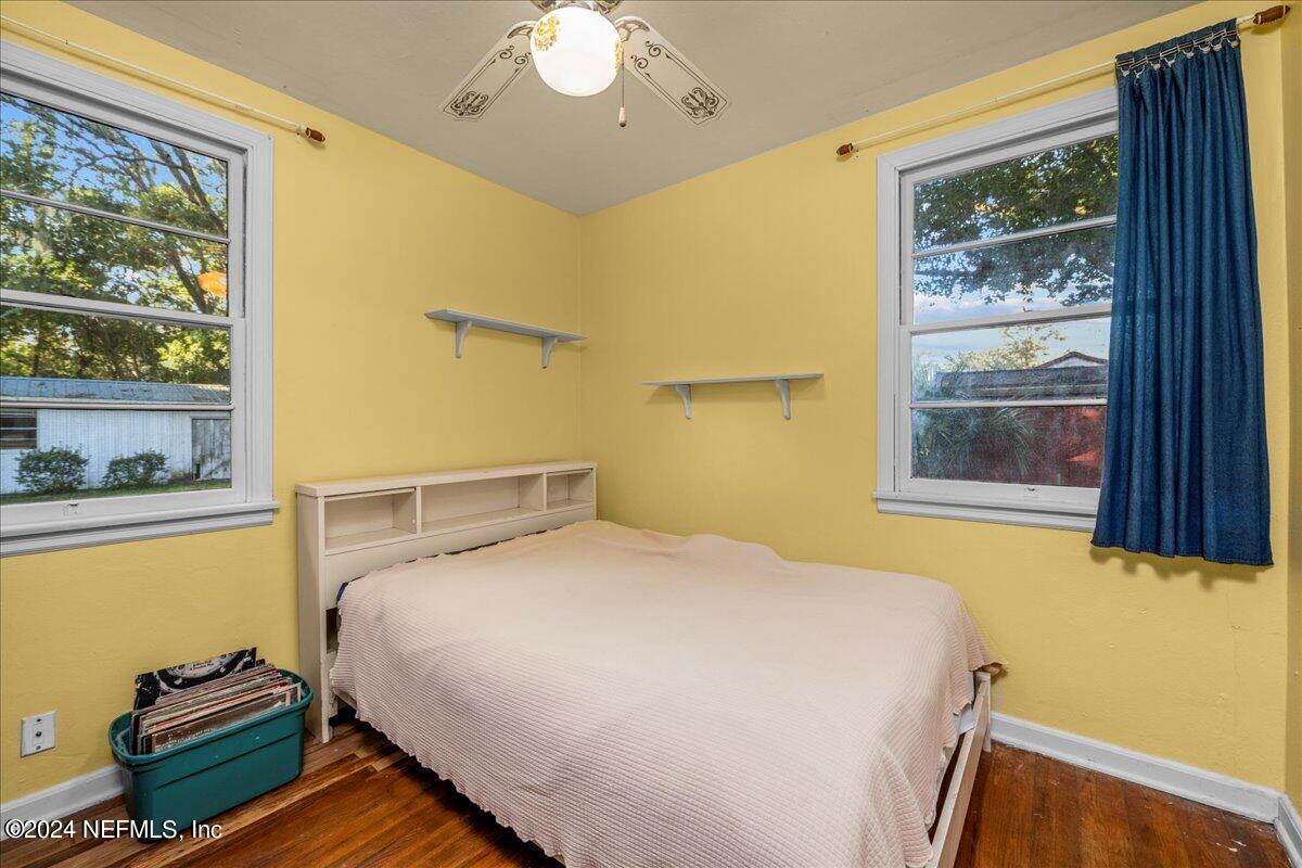 6554 Ortolan Avenue Jacksonville, FL 32216 - Photo 18 of 30 a bedroom with a bed and window