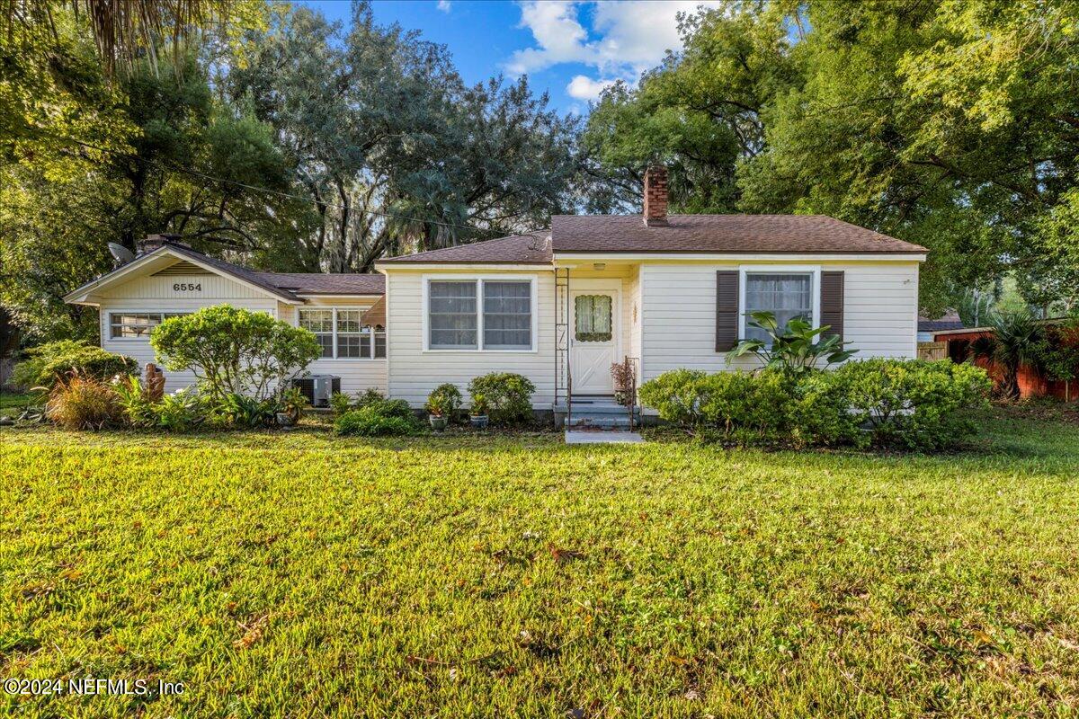 6554 Ortolan Avenue Jacksonville, FL 32216 - Photo 2 of 30 front view of a house with a yard