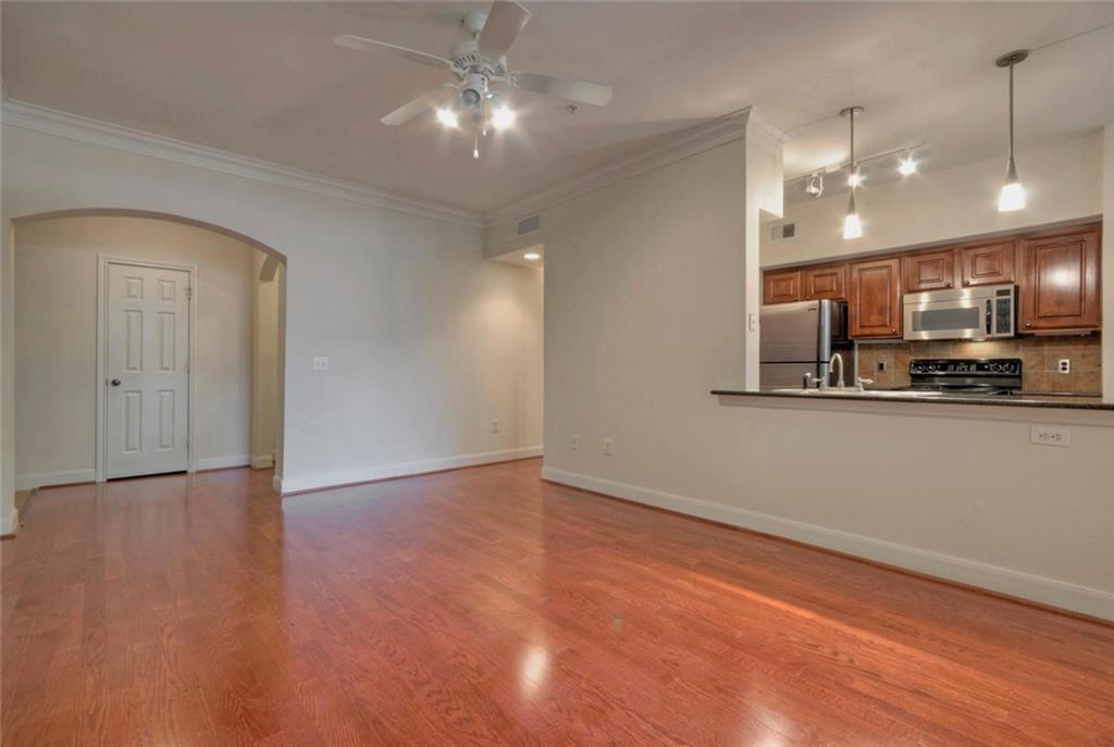7701 Rialto Boulevard, Unit 1326 Austin, TX 78735 - Photo 3 of 11 a view of kitchen with refrigerator and microwave