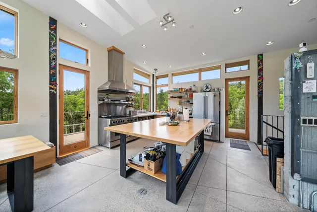 a bedroom with a bed furniture and a large window