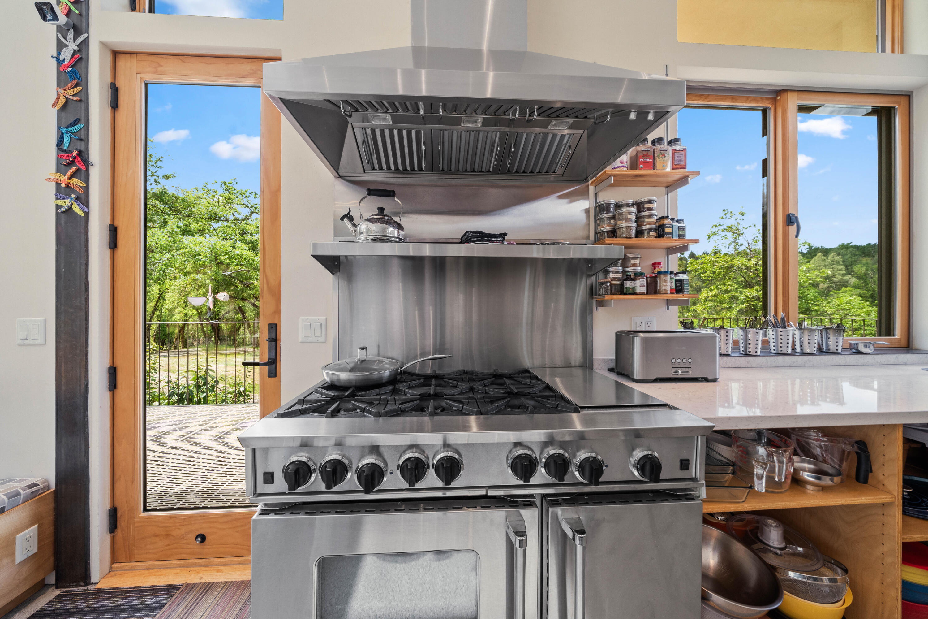 6691 Reading Creek Road Douglas City, CA 96024 - Photo 24 of 125 a kitchen with a stove a mirror and potted plant