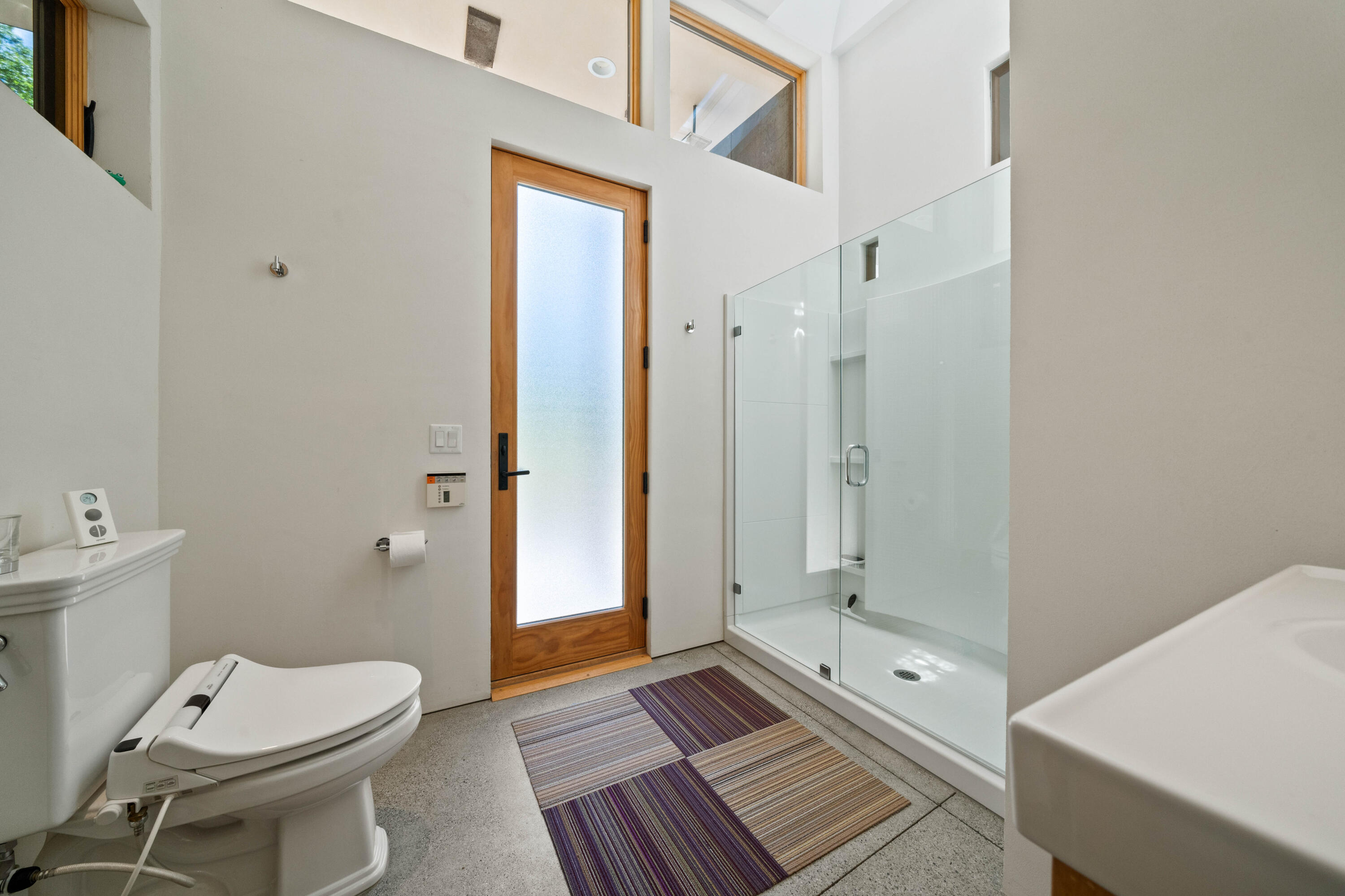 6691 Reading Creek Road Douglas City, CA 96024 - Photo 40 of 125 a bathroom with a granite countertop toilet a sink and shower