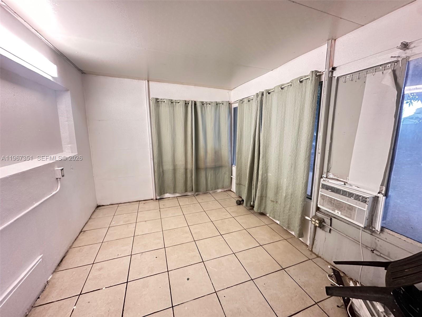 1829 Harding Street Hollywood, FL 33020 - Photo 11 of 15 a view of a room with a mirror and a shower