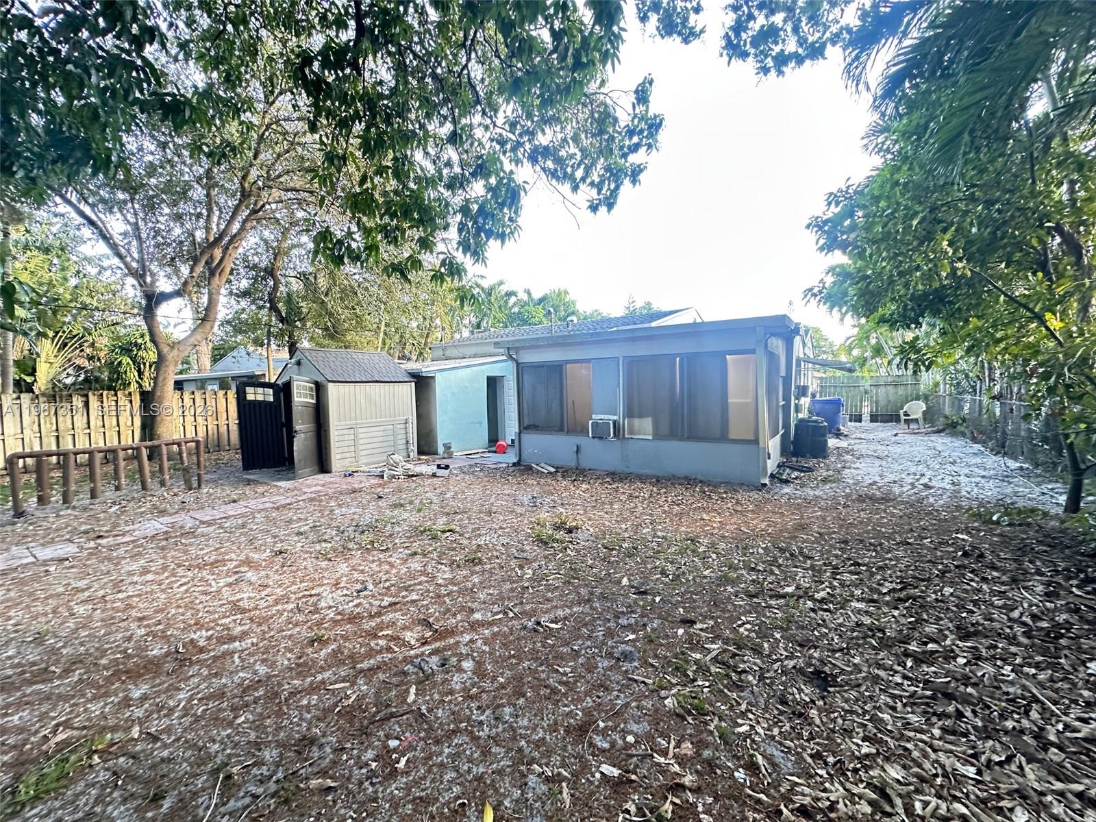 1829 Harding Street Hollywood, FL 33020 - Photo 15 of 15 a view of a house with a yard and a large tree