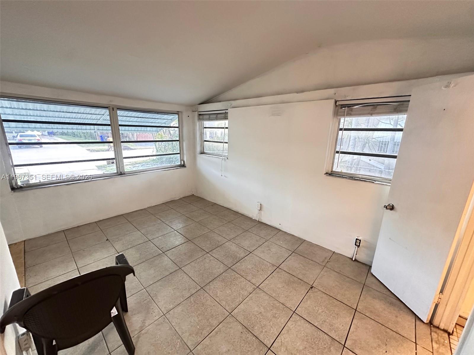 1829 Harding Street Hollywood, FL 33020 - Photo 5 of 15 a view of empty room with windows