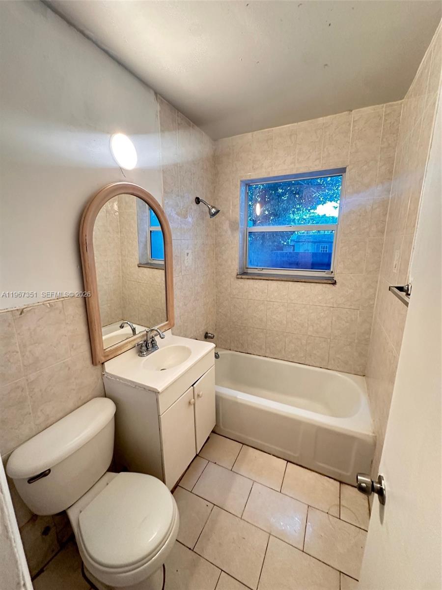 1829 Harding Street Hollywood, FL 33020 - Photo 8 of 15 a bathroom with a sink a toilet and a bathtub