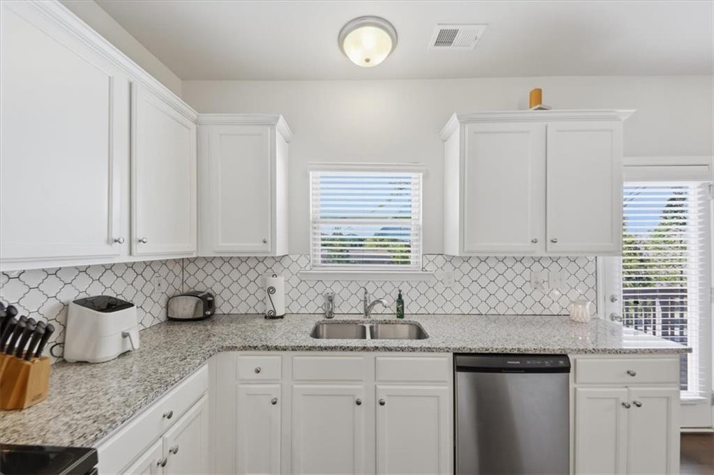 4154 Integrity Way Powder Springs, GA 30127 - Photo 13 of 52 a kitchen with granite countertop a sink and cabinets