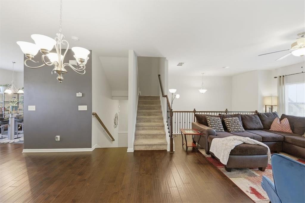 4154 Integrity Way Powder Springs, GA 30127 - Photo 20 of 52 a living room with furniture and wooden floor