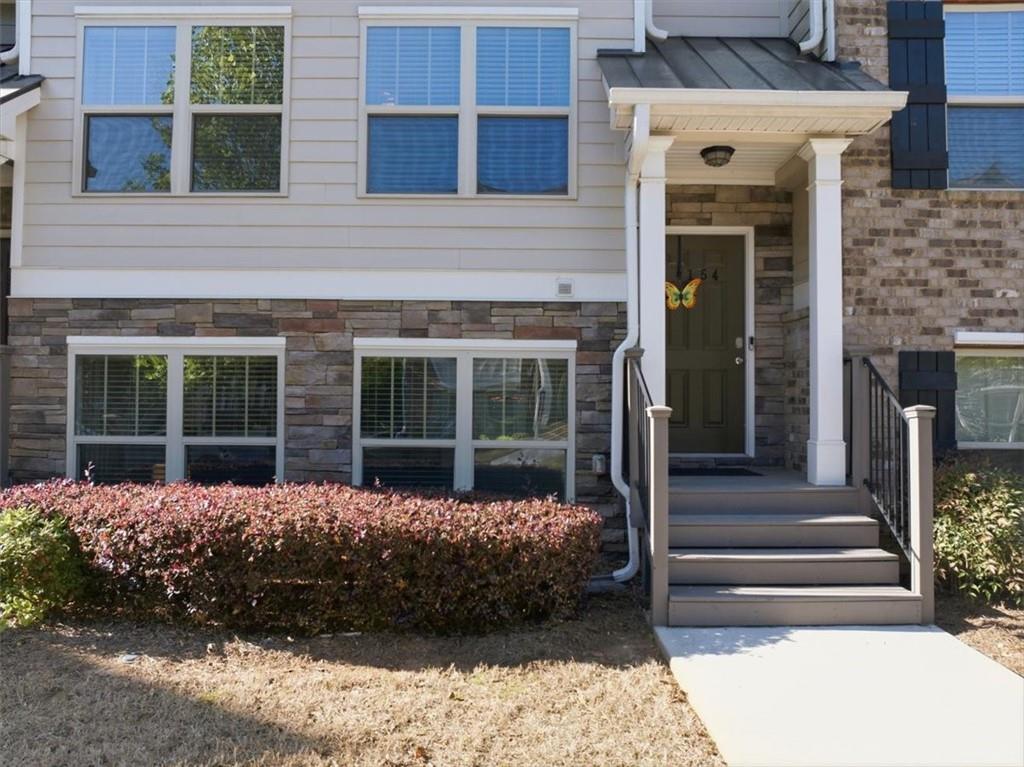 4154 Integrity Way Powder Springs, GA 30127 - Photo 2 of 52 a house view with a outdoor space