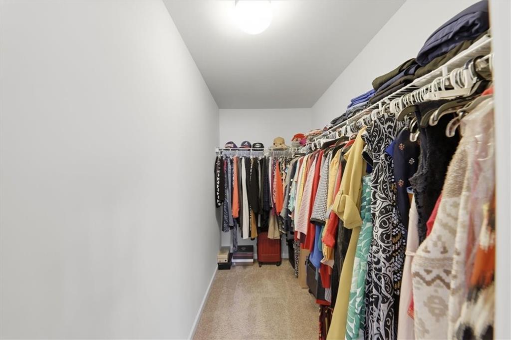 4154 Integrity Way Powder Springs, GA 30127 - Photo 42 of 52 a view of walk in closet with clothes