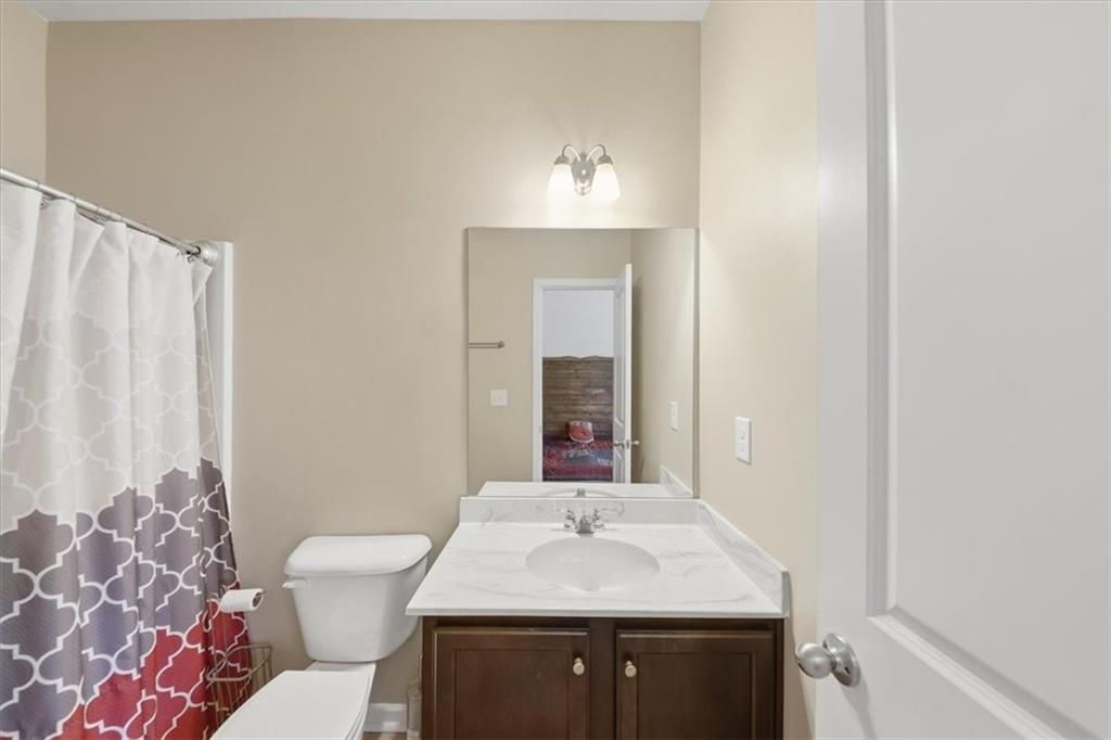 4154 Integrity Way Powder Springs, GA 30127 - Photo 8 of 52 a bathroom with a sink and a mirror