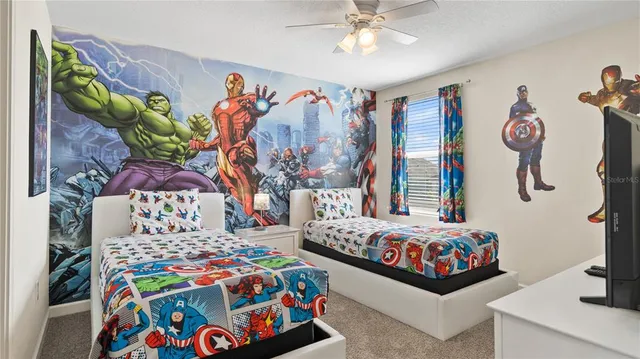 a bedroom with two beds and a couch