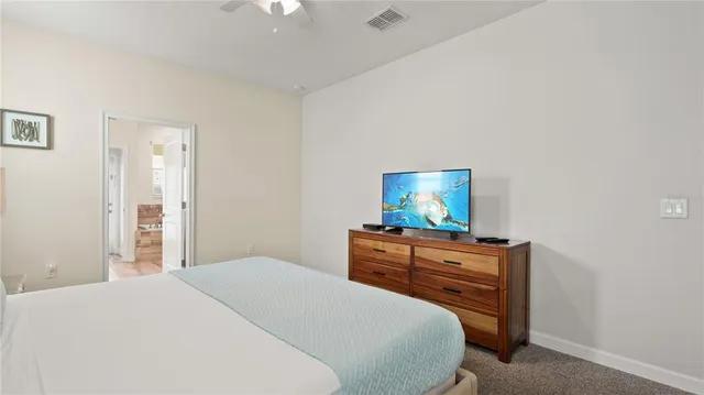 a bedroom with a bed and a dresser