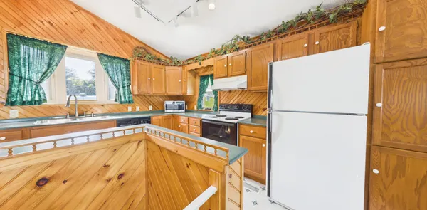 a backyard of a house with lots of green space