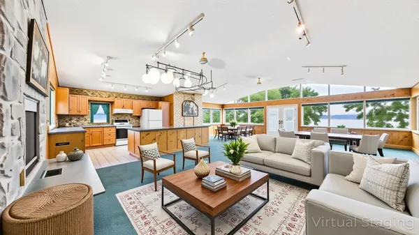 a living room with patio furniture and a potted plant