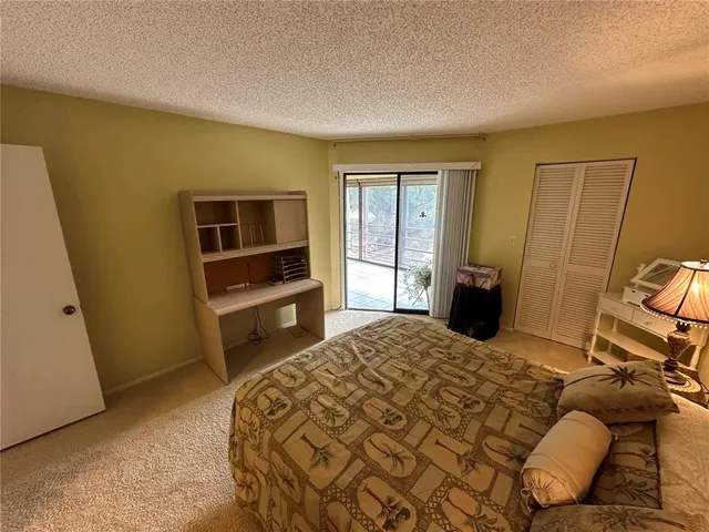 a bedroom with a bed and furniture