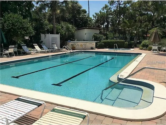 a view of a swimming pool with a patio
