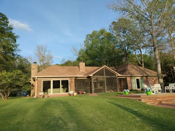a front view of house with yard and green space