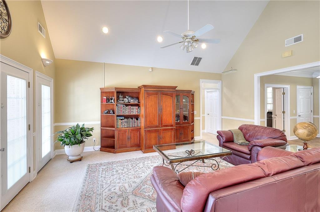 452 Mount Vernon Road Northwest Monroe, GA 30655 - Photo 7 of 50 a living room with furniture and flowers