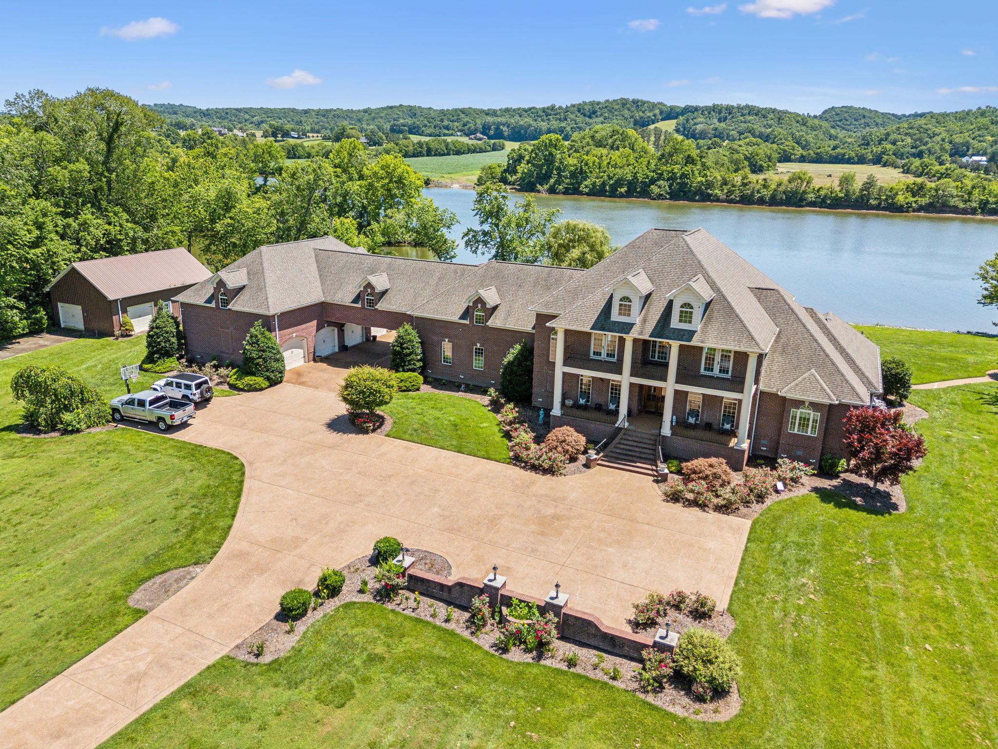 an aerial view of a house with a garden and a yard