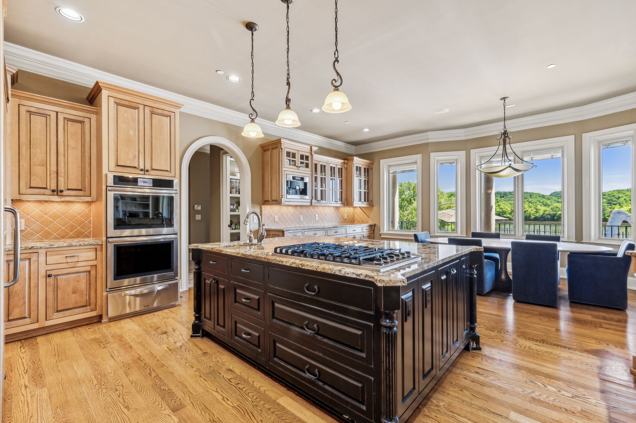 6035 River Trace Nashville, TN 37218 - Photo 19 of 68 a kitchen with stainless steel appliances granite countertop a stove and a view of living room