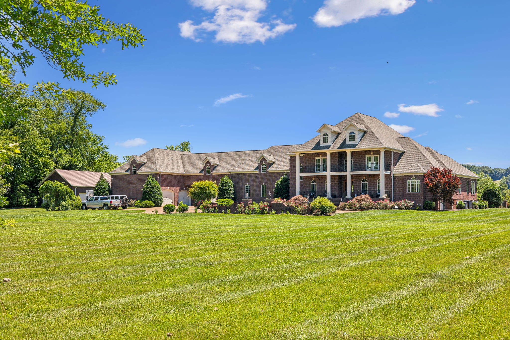 6035 River Trace Nashville, TN 37218 - Photo 2 of 68 a view of a big room with a big yard and large trees