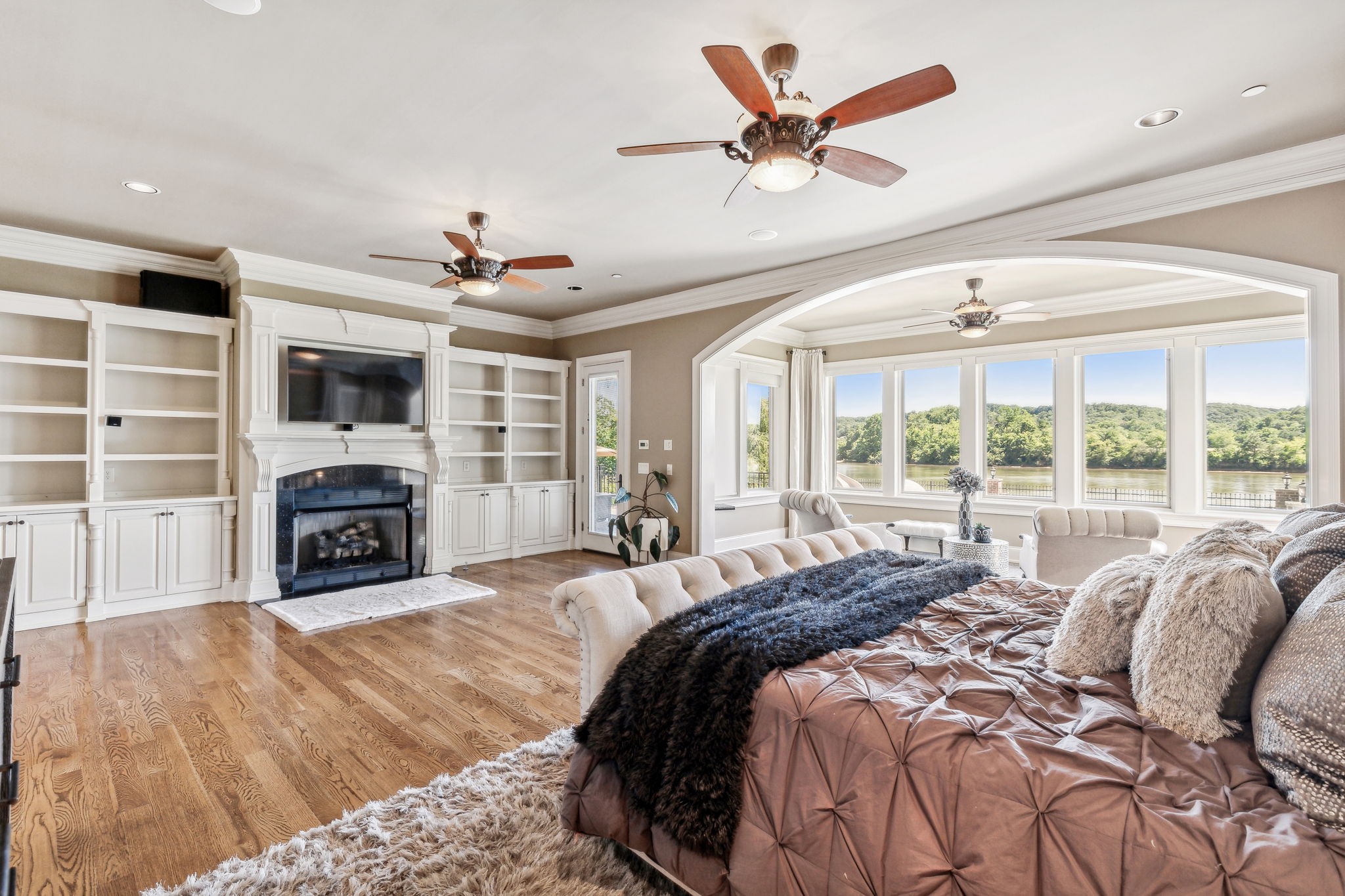 6035 River Trace Nashville, TN 37218 - Photo 27 of 68 a spacious bedroom with a large bed and a fireplace