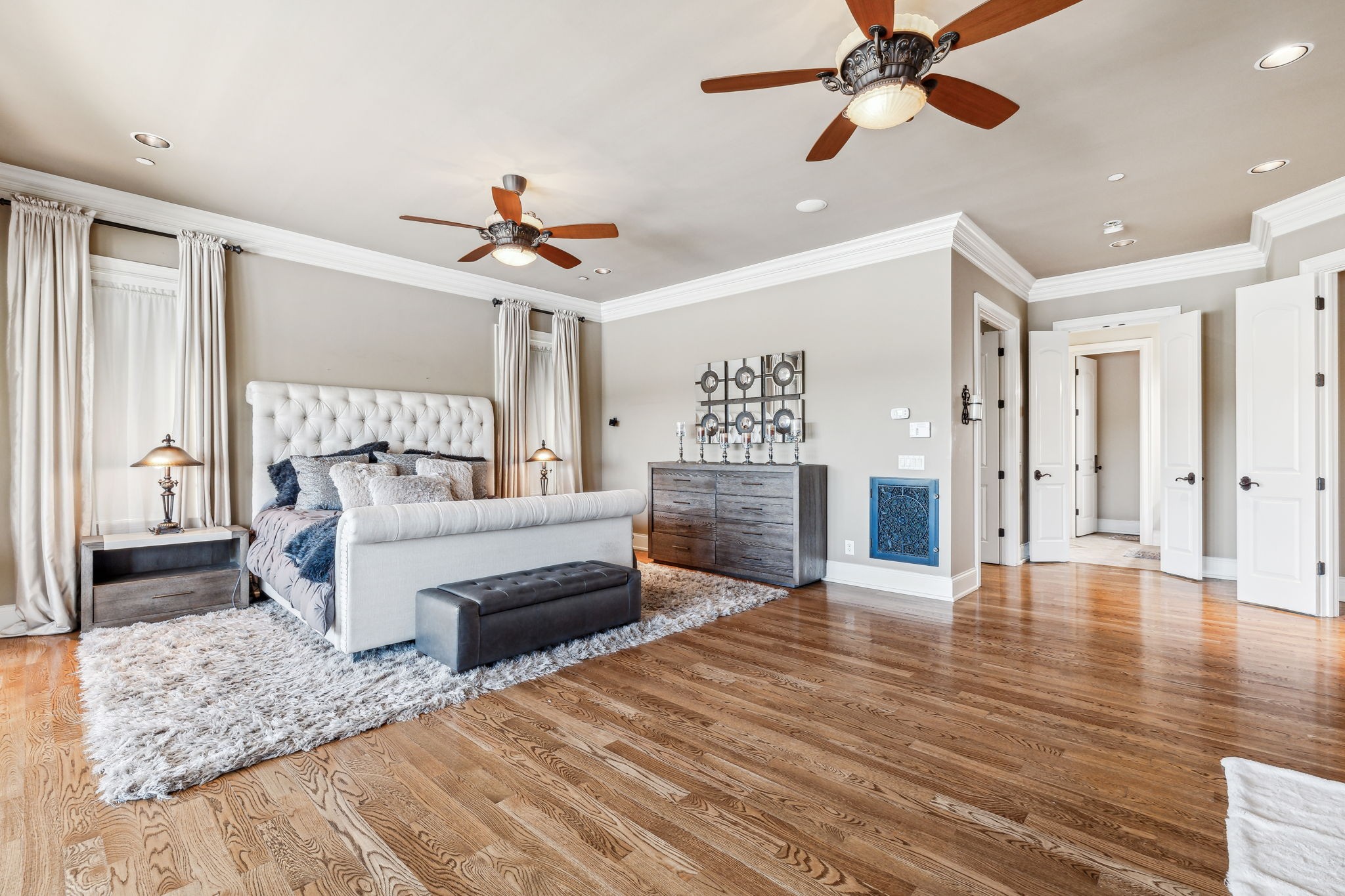 6035 River Trace Nashville, TN 37218 - Photo 31 of 68 a bedroom with a bed and a chandelier