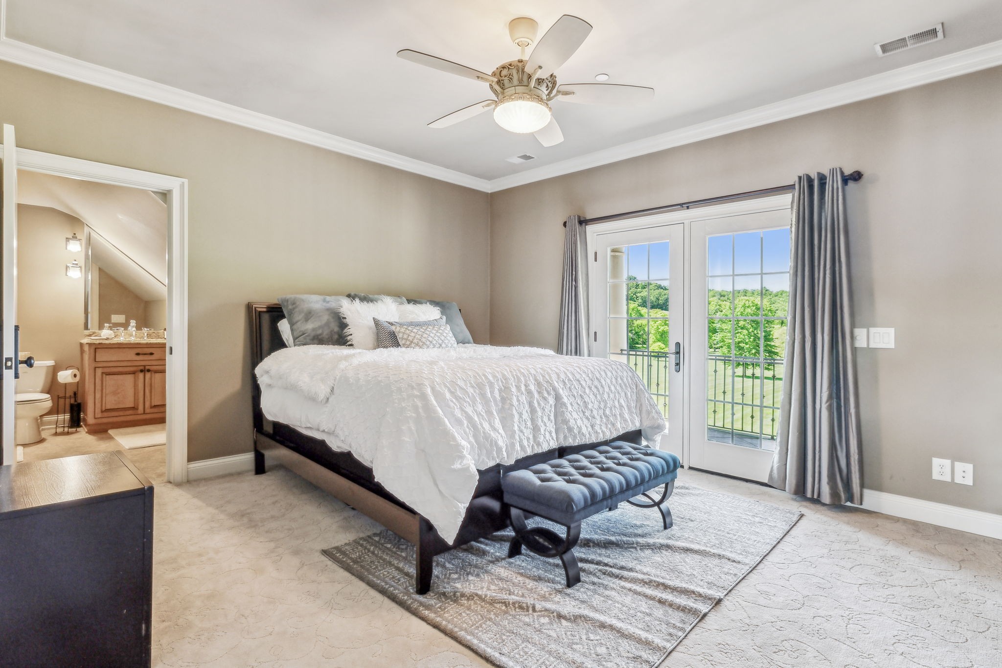 6035 River Trace Nashville, TN 37218 - Photo 37 of 68 a bedroom with a bed a chandelier and a couch