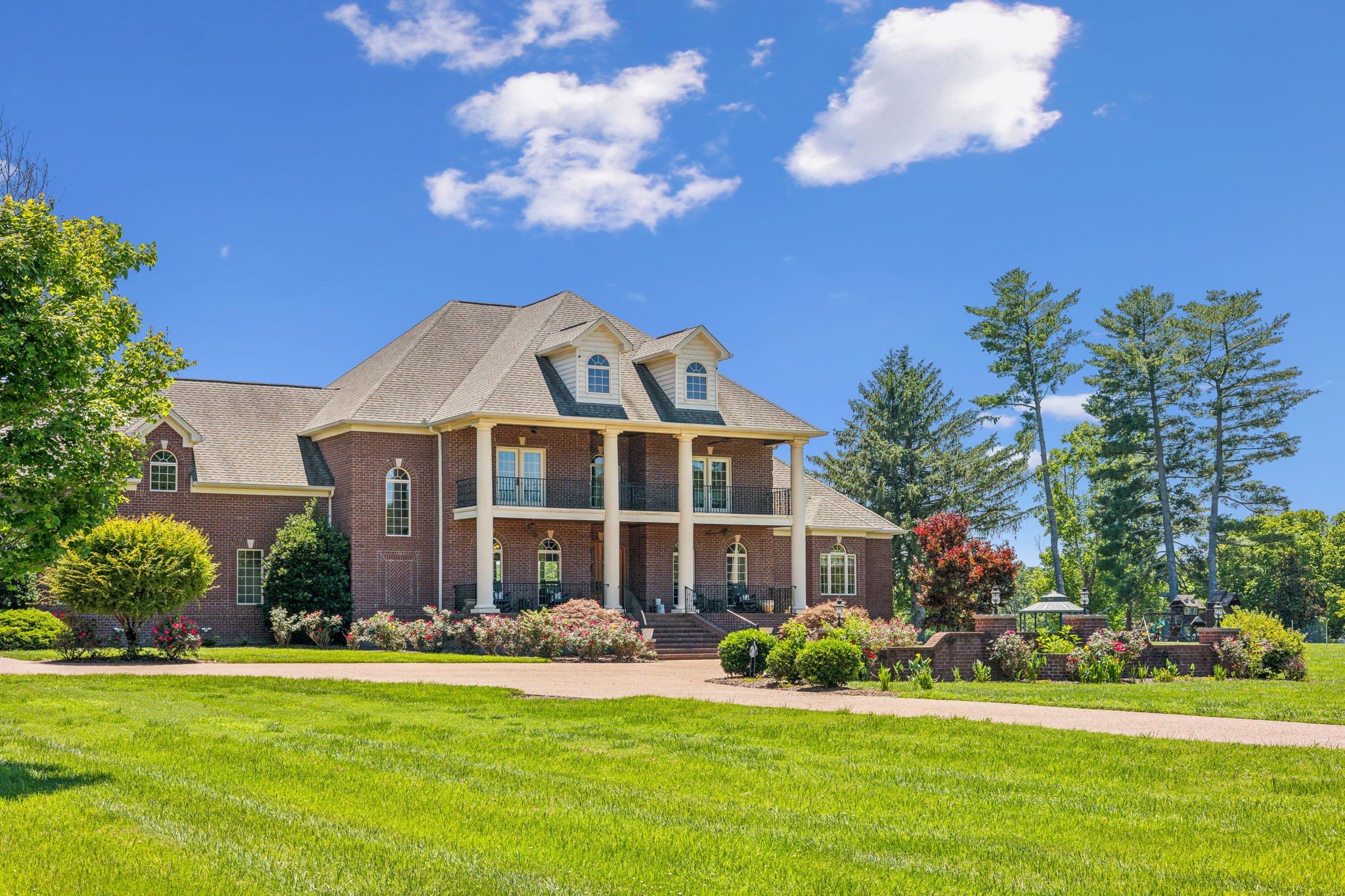 6035 River Trace Nashville, TN 37218 - Photo 5 of 68 a front view of a house with a garden and yard