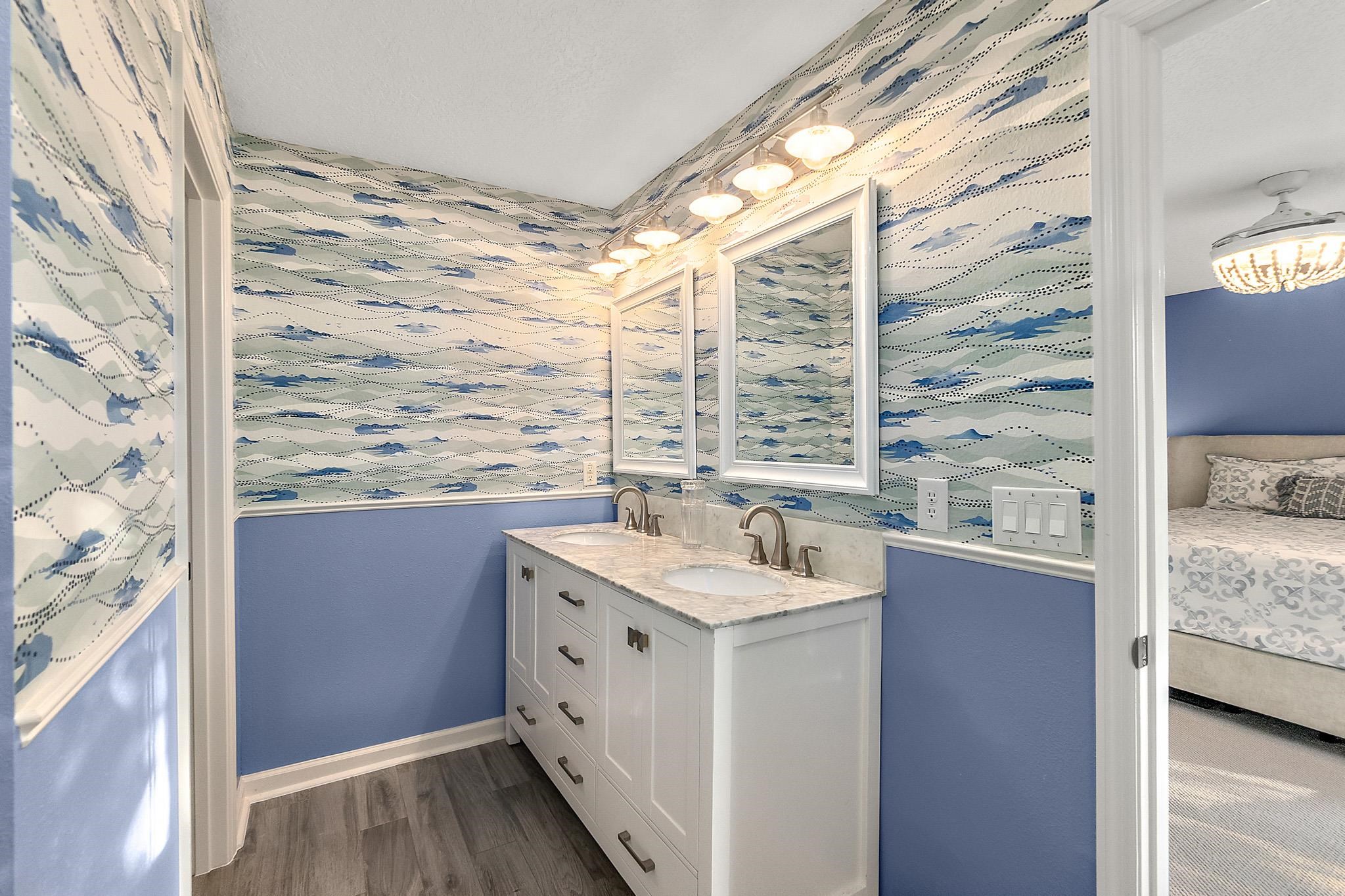 915 Saltwater Circle St. Augustine, FL 32080 - Photo 29 of 60 a bathroom with a granite countertop sink and a mirror