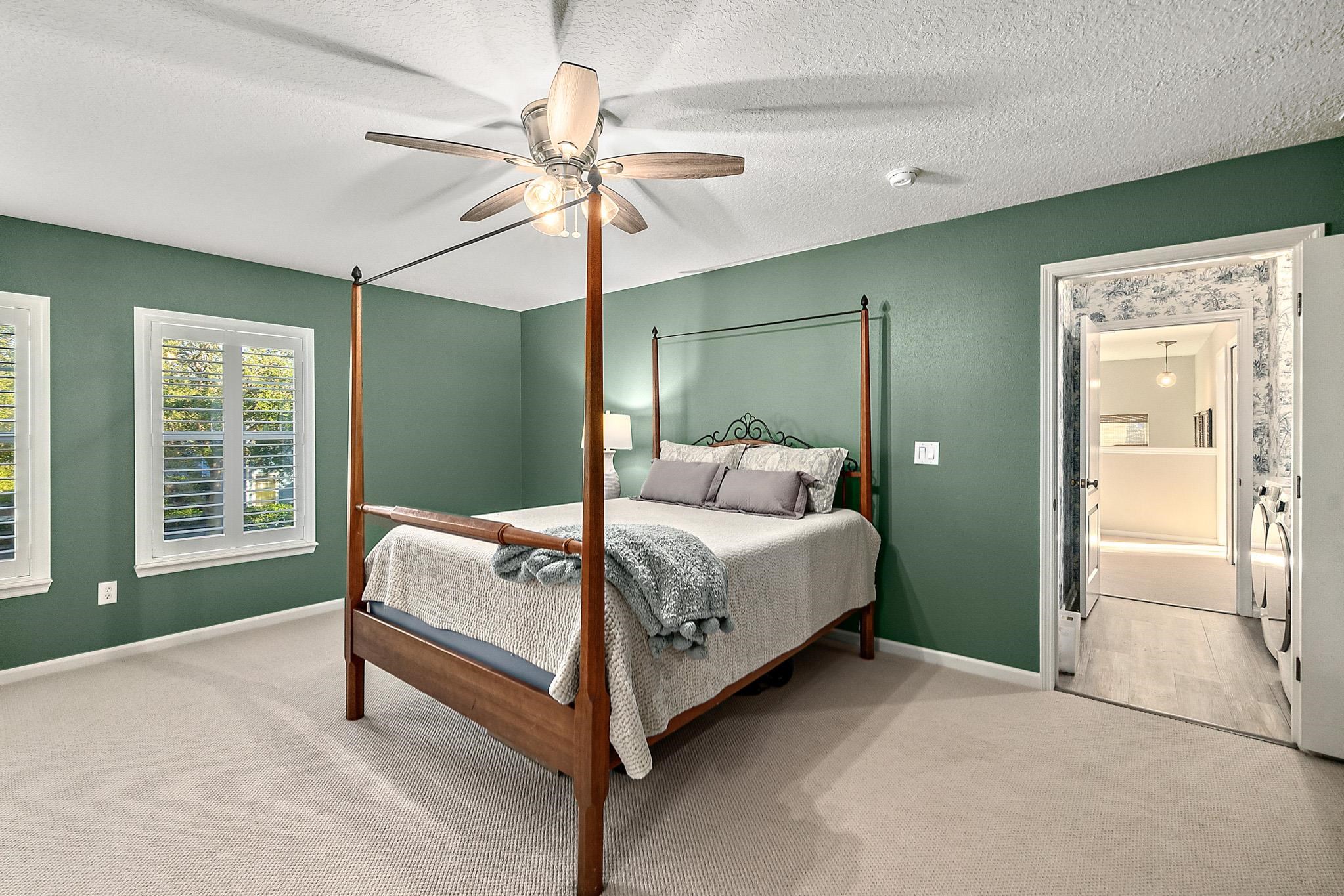 915 Saltwater Circle St. Augustine, FL 32080 - Photo 30 of 60 Bedroom featuring carpet floors, ceiling fan, and a textured ceiling
