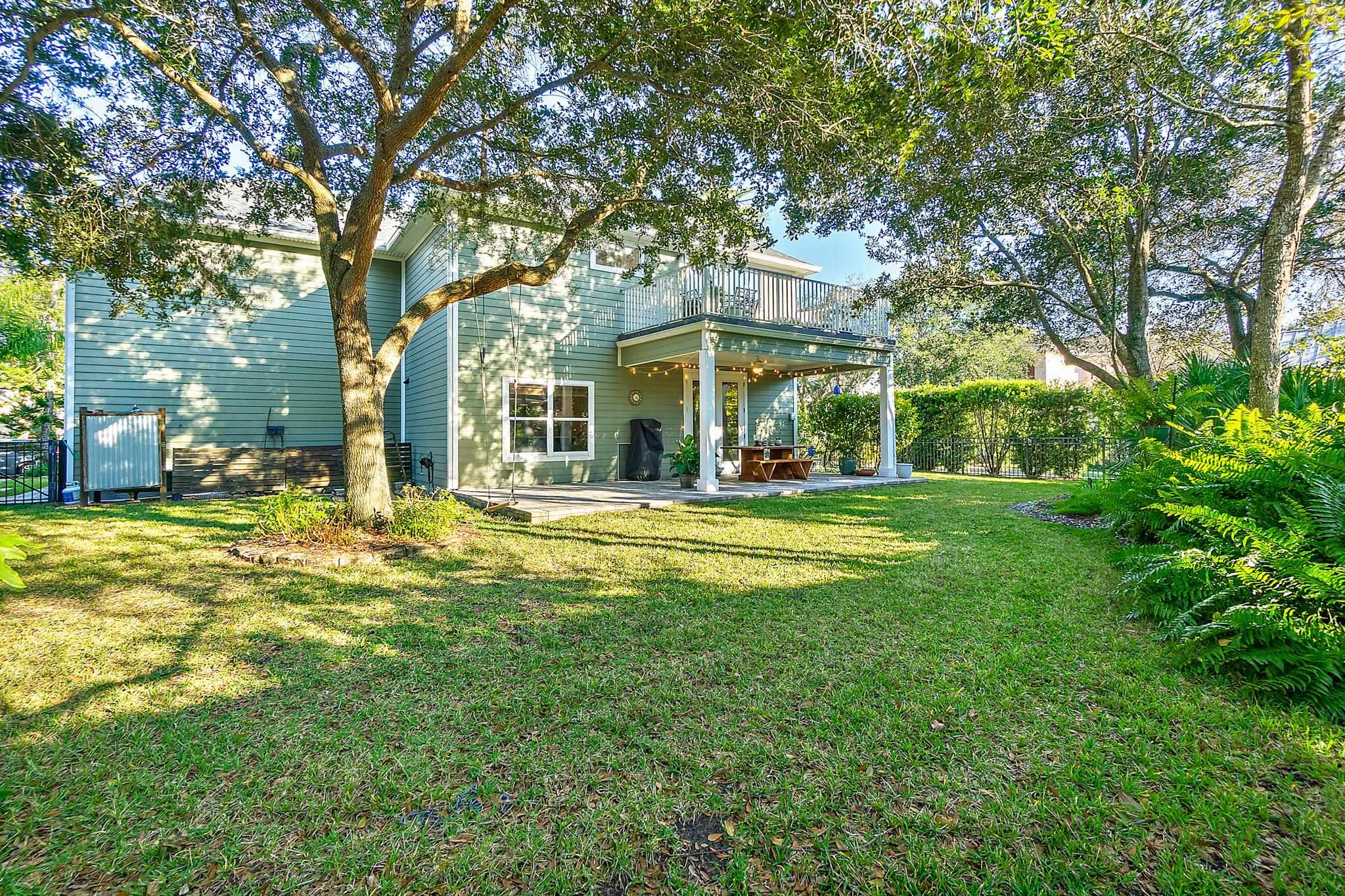 915 Saltwater Circle St. Augustine, FL 32080 - Photo 43 of 60 a front view of a building with a garden