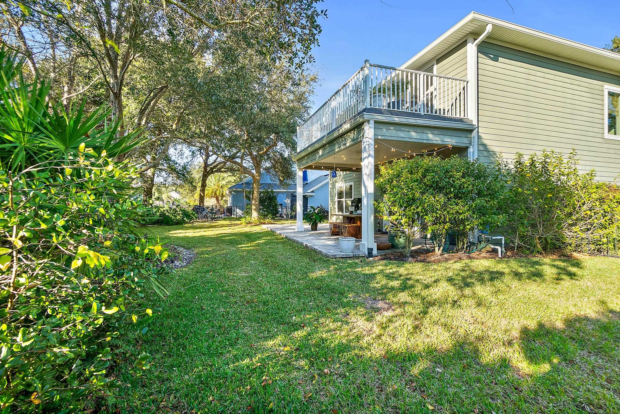 915 Saltwater Circle St. Augustine, FL 32080 - Photo 44 of 60 View of grassy yard with a patio area and a deck