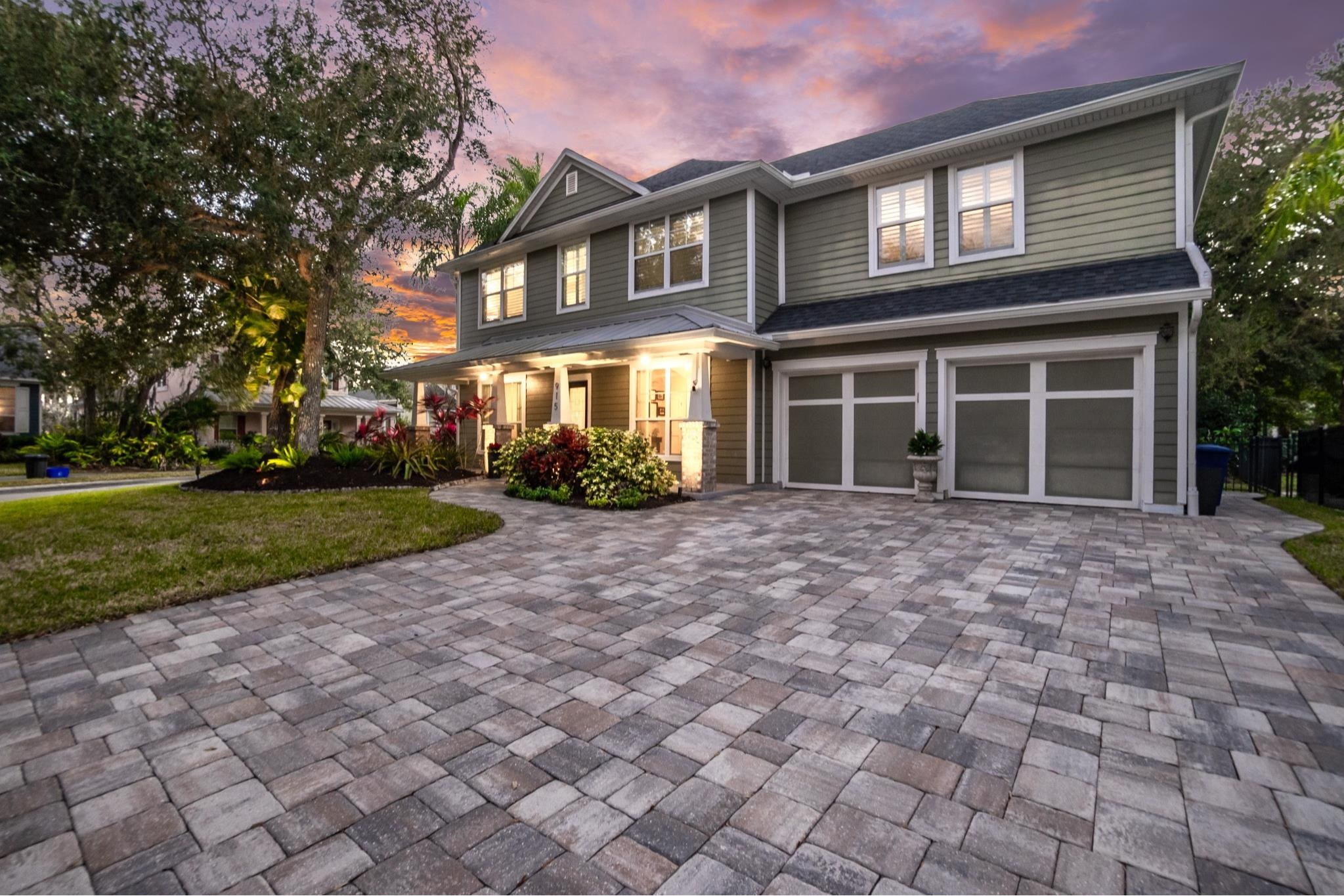 915 Saltwater Circle St. Augustine, FL 32080 - Photo 53 of 60 a front view of a house with a yard and potted plants