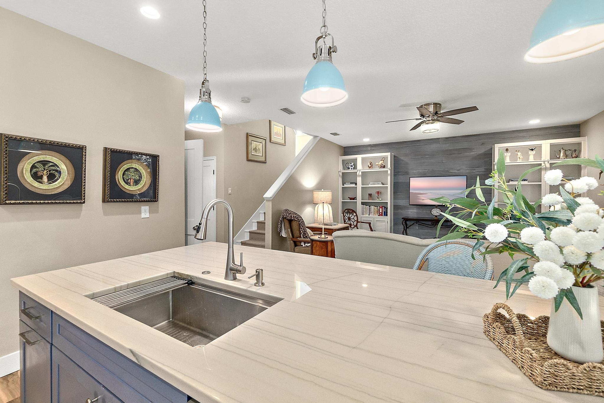 915 Saltwater Circle St. Augustine, FL 32080 - Photo 10 of 60 a kitchen with a sink a counter and cabinets
