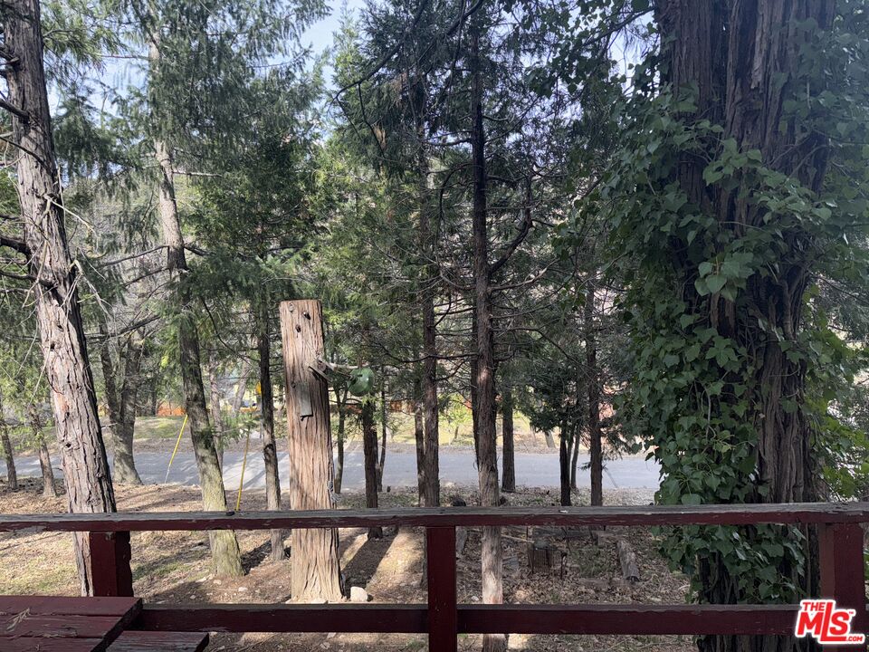 21801 Plunge Road Cedarpines Park, CA 92322 - Photo 3 of 6 a view of a wooden fence and trees