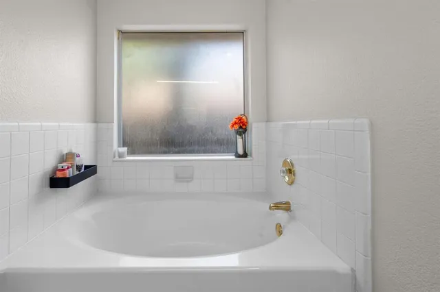 a bathroom with a bathtub