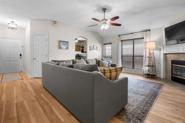 a living room with furniture and a fireplace