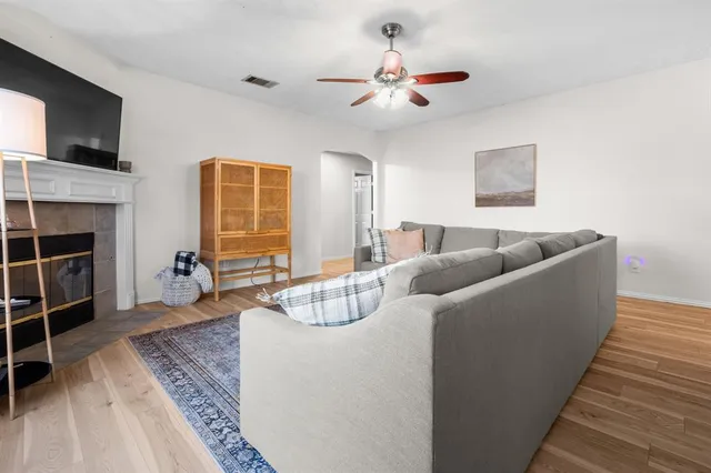a living room with furniture and a fireplace