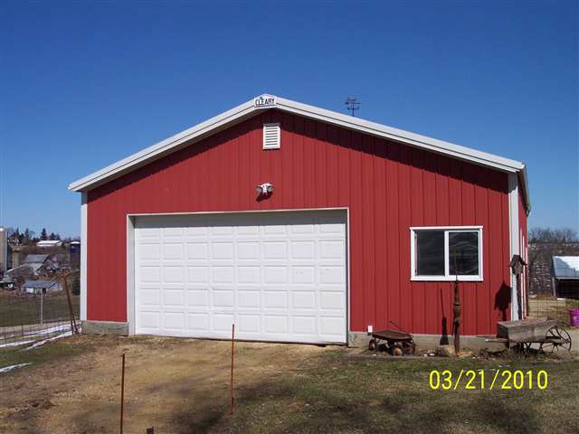 6697 North Lake Road Lena, IL 61048 - Photo 3 of 9 a front view of a house with garage