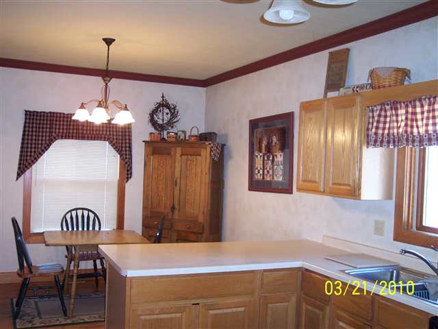 6697 North Lake Road Lena, IL 61048 - Photo 6 of 9 a view of a dining room with furniture
