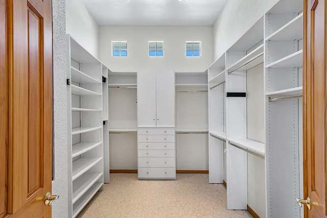 a view of an empty walk in closet
