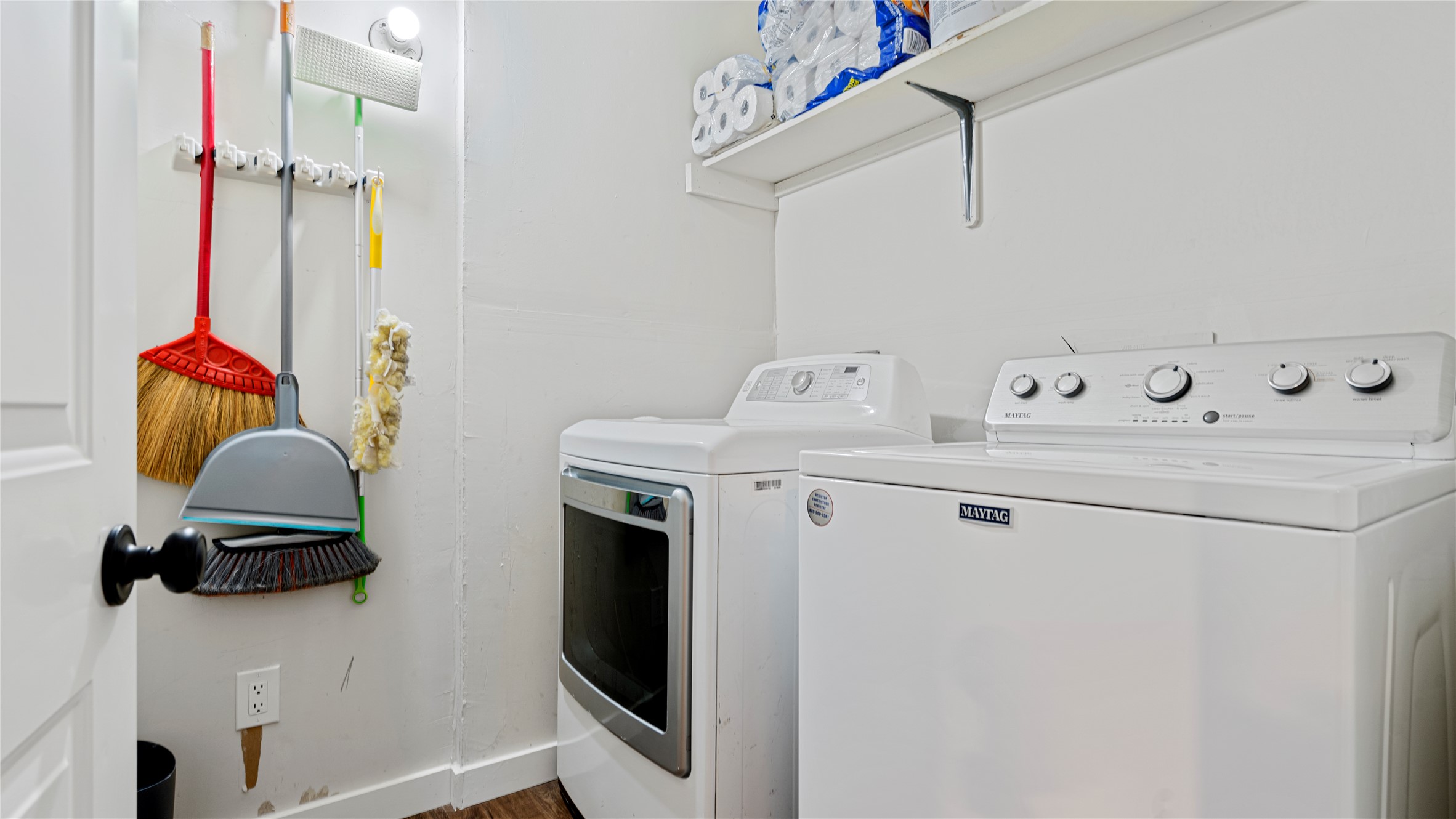 3108 Linnet Drive Austin, TX 78745 - Photo 14 of 24 Laundry room with washer and clothes dryer and dark wood finished floors