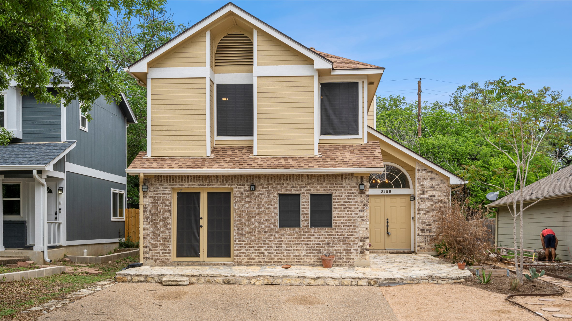 3108 Linnet Drive Austin, TX 78745 - Photo 3 of 24 View of front of home featuring brick siding, french doors, a patio, and roof with shingles
