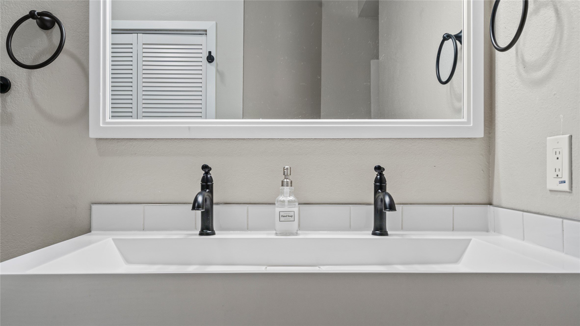 3108 Linnet Drive Austin, TX 78745 - Photo 9 of 24 Detailed view of a textured wall and double vanity