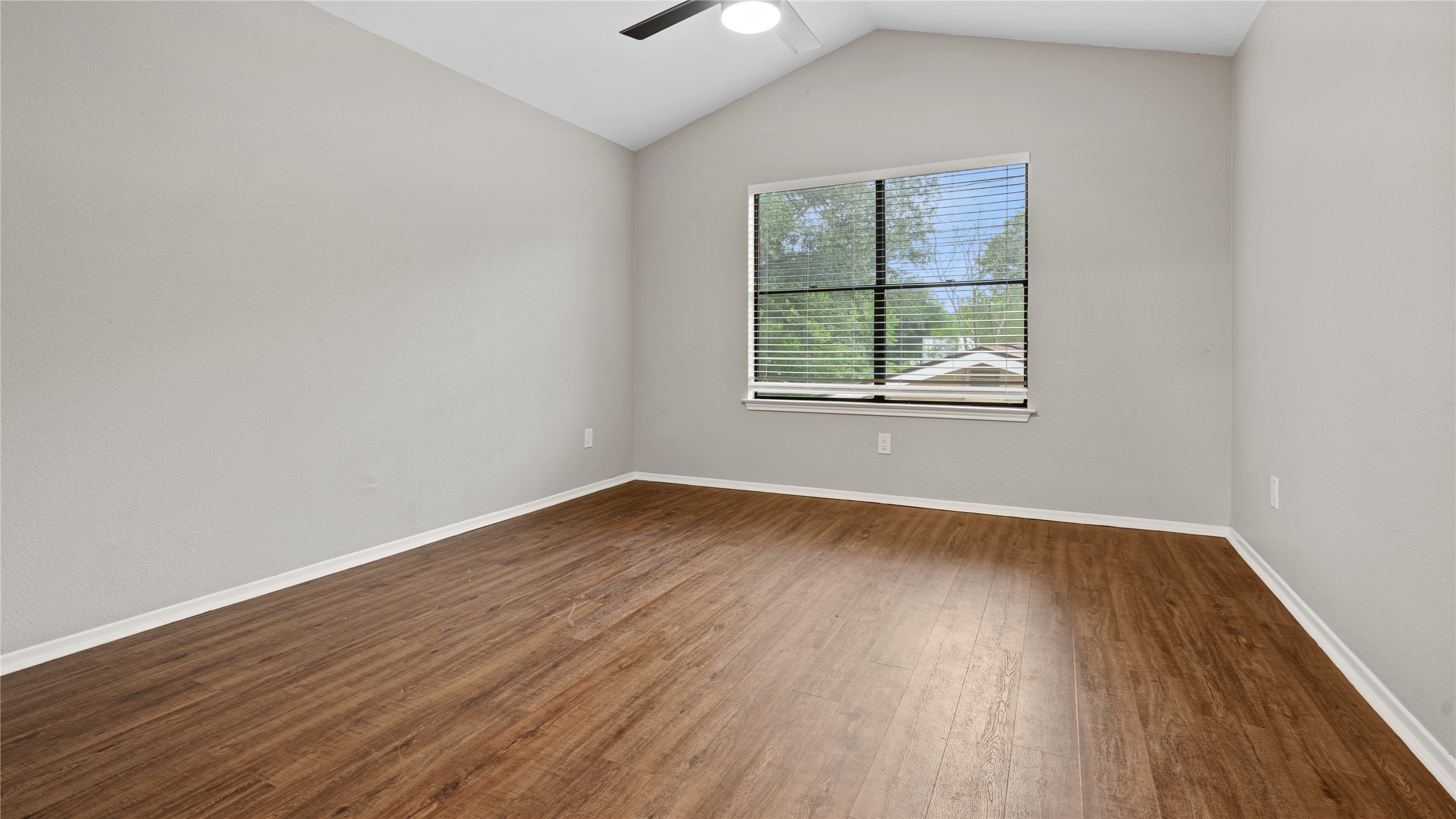 3108 Linnet Drive Austin, TX 78745 - Photo 10 of 24 Unfurnished room with dark wood-style floors and a ceiling fan